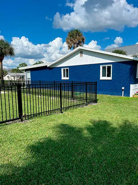 Black aluminum fence and gate at a Florida property