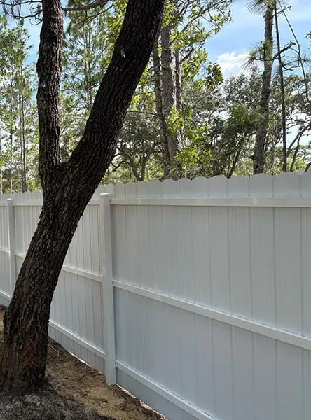 White PVC privacy fence at a residential property
