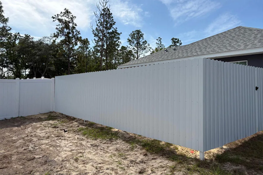 White PVC privacy fence around a residential yard