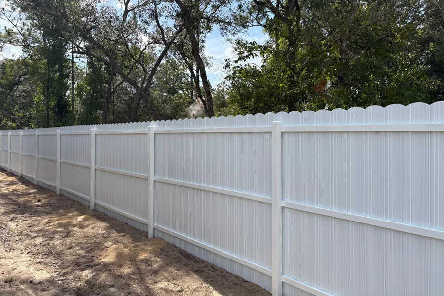 White PVC privacy fence with decorative top detail