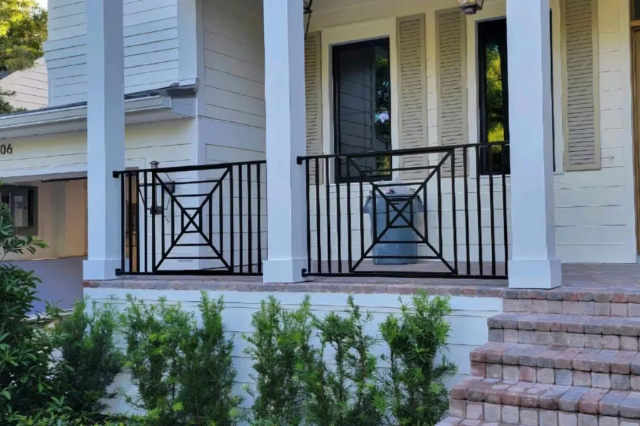 Black metal railing at a front porch