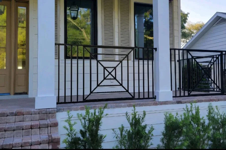 Black metal entry railing at a residence