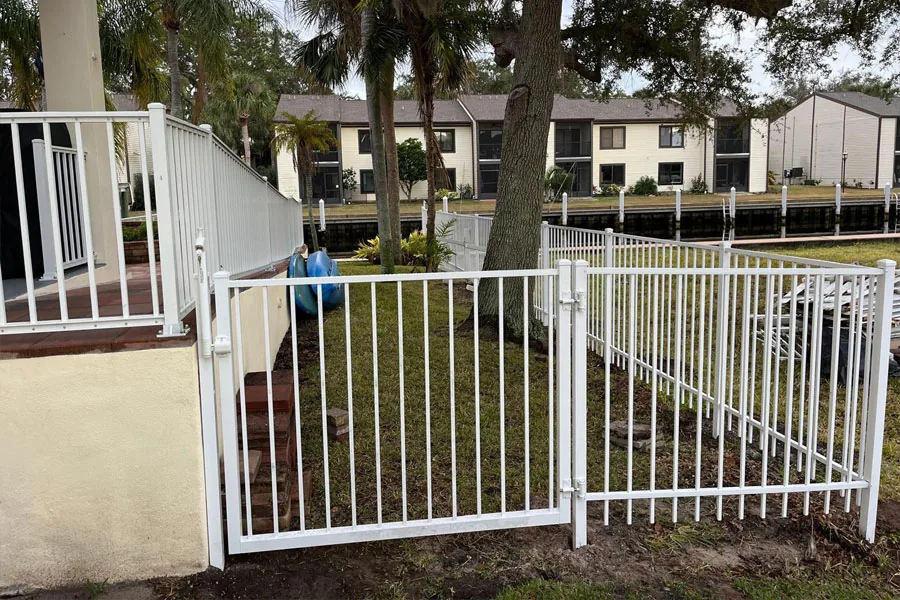 White aluminum pool access gate