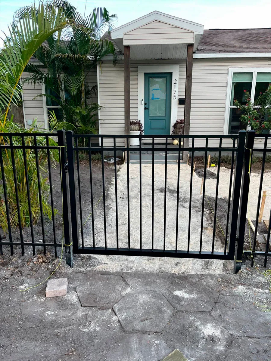 Black aluminum fence at a residential entry
