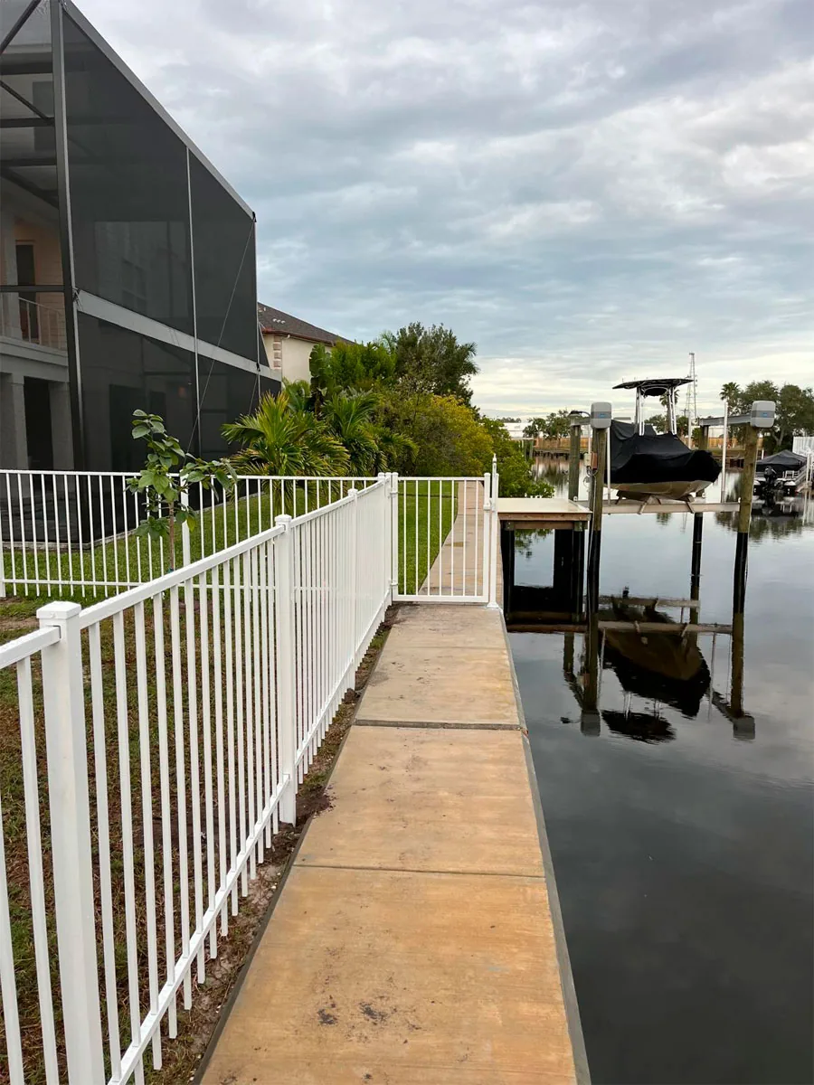 White aluminum railing beside a pool