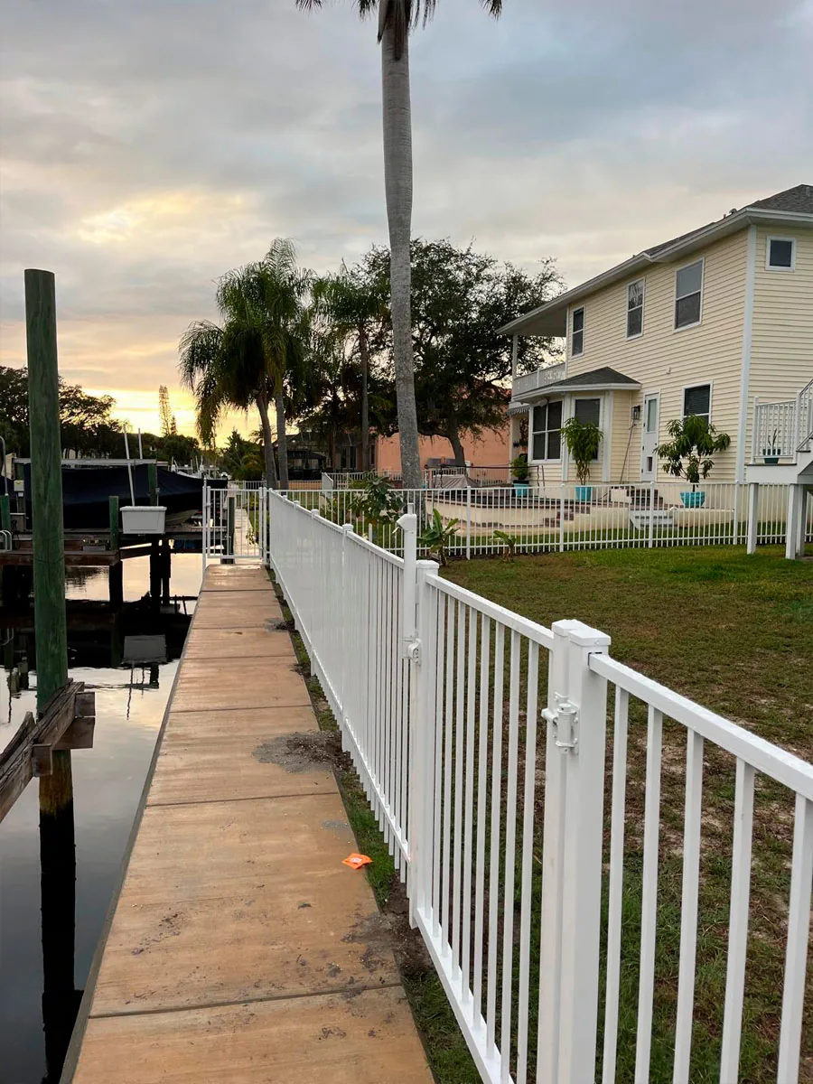 White aluminum railing along a residential walkway