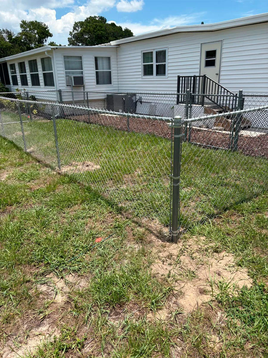Chain link perimeter fence at a home