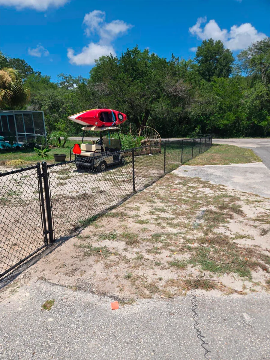 Chain link access gate at a yard