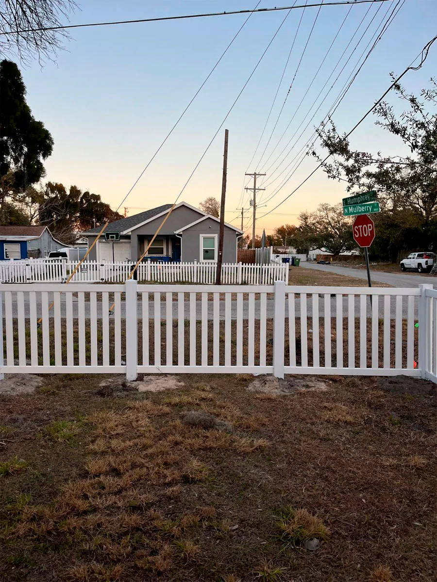 White PVC picket fence at a home