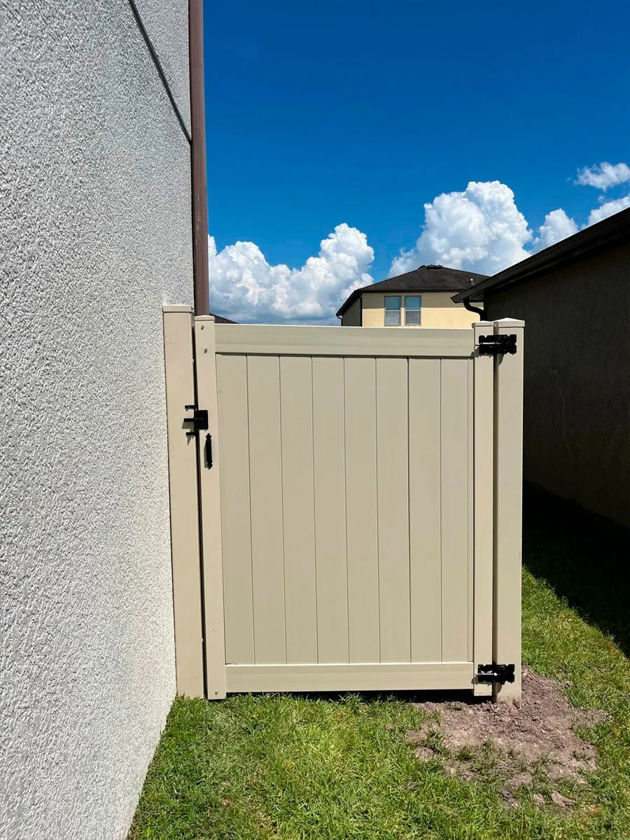 White PVC side-yard access gate