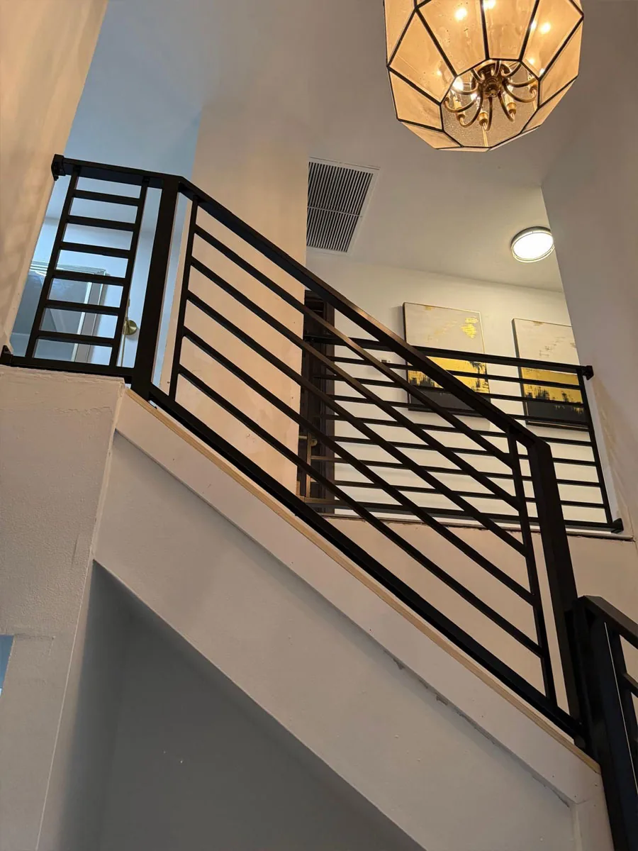 Black metal railing on an interior staircase
