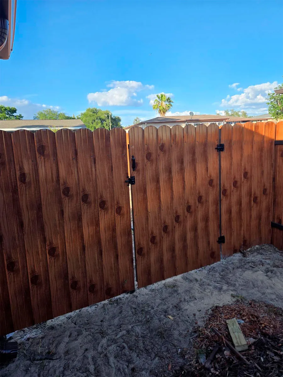 Wood privacy fence with a matching gate