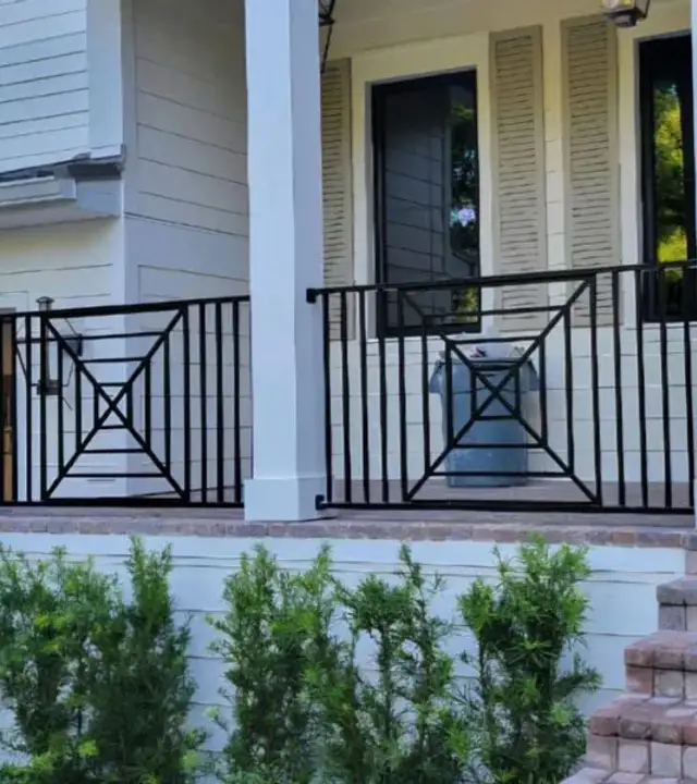 Black metal railing at a front porch