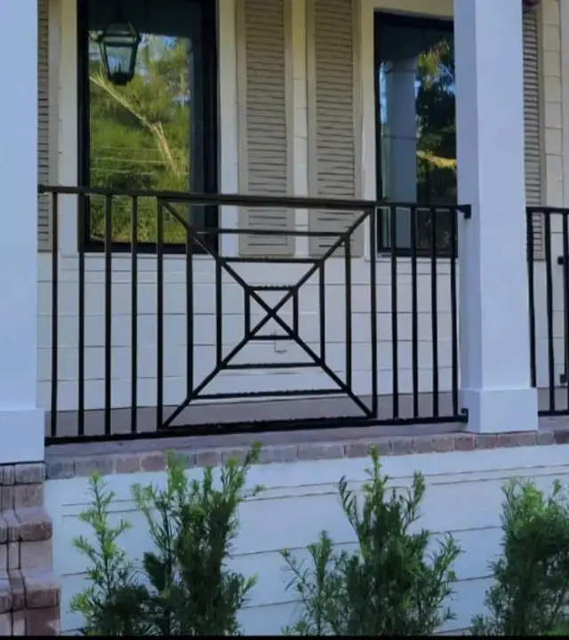 Black metal entry railing at a residence